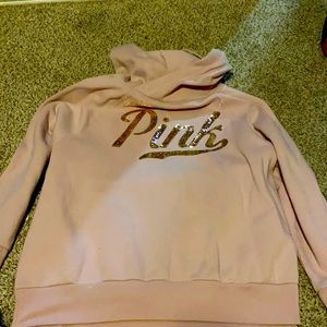 Pink hoodie with gold lettering